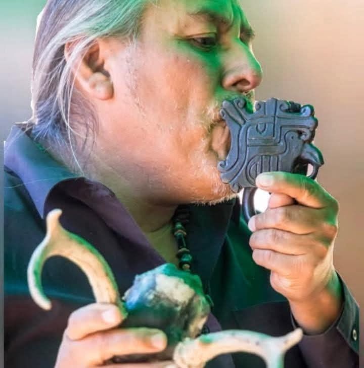 Alffedo playing a replica of an ancient whistle